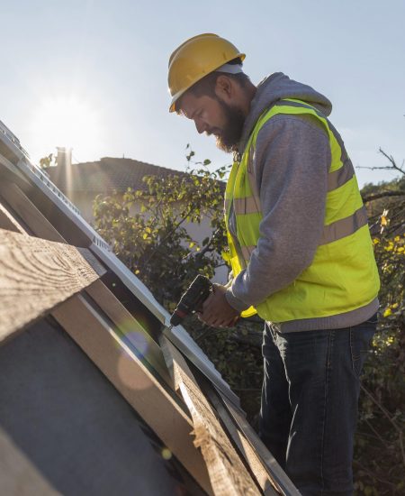 man-working-roof-with-drill-1-scaled-1.jpg